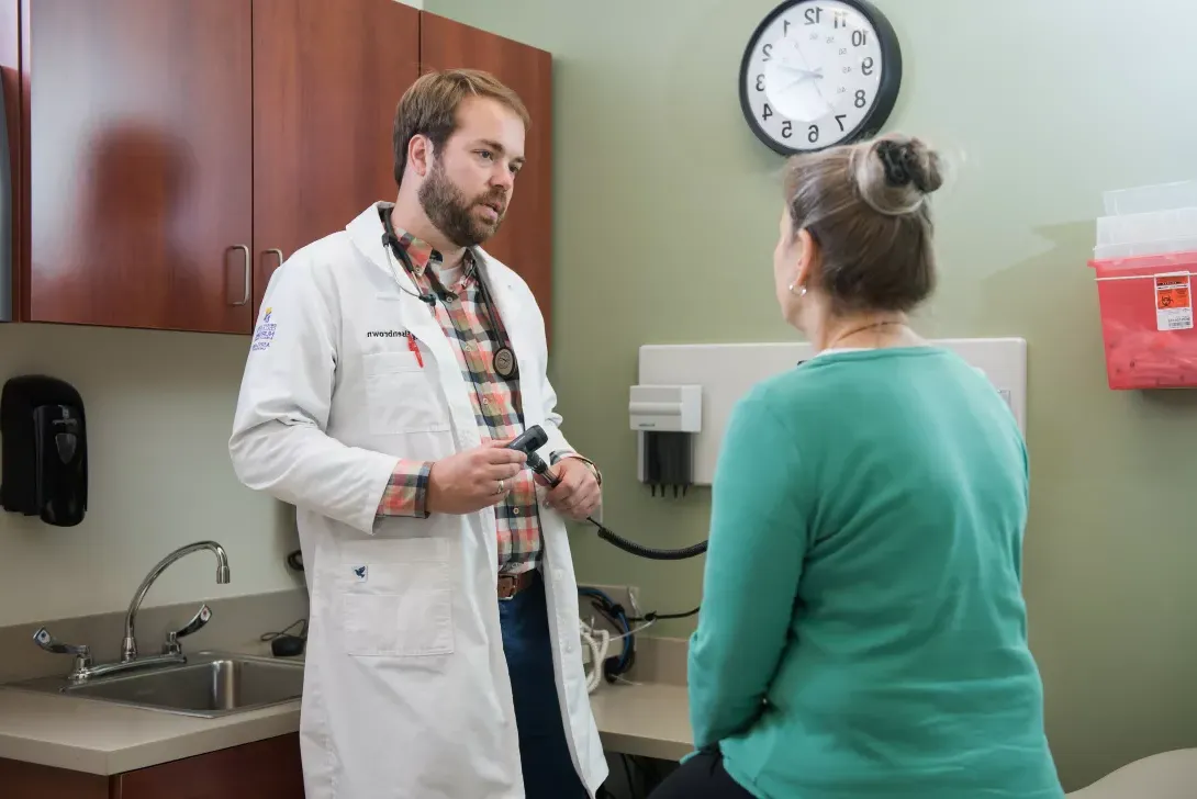 Nursing student examining a patient